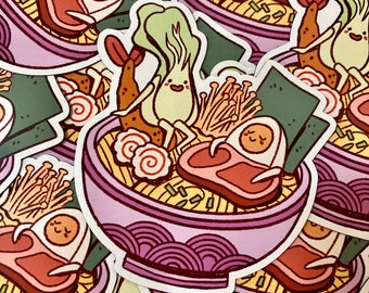 May include: A sticker featuring a cartoon illustration of a bowl of ramen with various toppings, including a smiling green vegetable, a pink egg, and a piece of meat. The bowl is purple with a white rim and is decorated with a wave pattern.