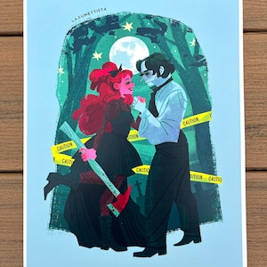 May include: A digital illustration of a couple standing in a forest at night. The woman has red hair and is holding an axe. The man is wearing a white shirt and black pants. The text "LA FUMETTISTA" is at the top of the image. There is a yellow caution tape around the couple.