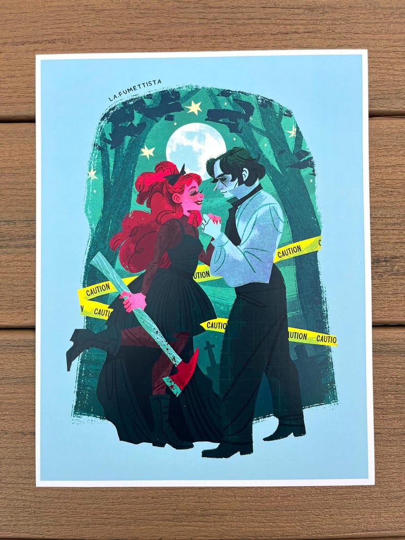 May include: A digital illustration of a couple standing in a forest at night. The woman has red hair and is holding an axe. The man is wearing a white shirt and black pants. The text "LA FUMETTISTA" is at the top of the image. There is a yellow caution tape around the couple.