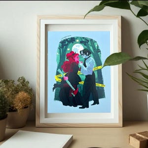 May include: A framed print of a digital illustration of a couple standing in a forest. The woman has red hair and is wearing a black dress. The man is wearing a white shirt and black pants. The background is a blue sky with stars and a moon. The print is surrounded by a white mat and a wooden frame.