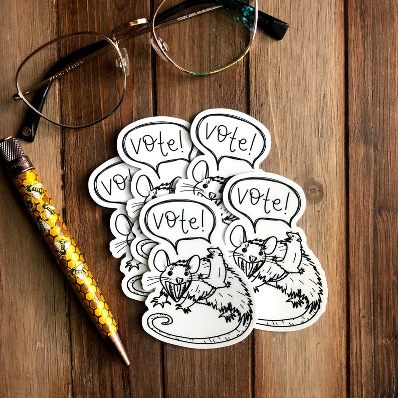 May include: A set of six black and white stickers featuring cartoon rats with the word "Vote!" in a speech bubble above each rat.