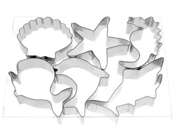 Ensemble d'emporte-pièces sur le thème des créatures de l'océan comprenant un requin-baleine, un dauphin, une coquille, une étoile de mer, un hippocampe