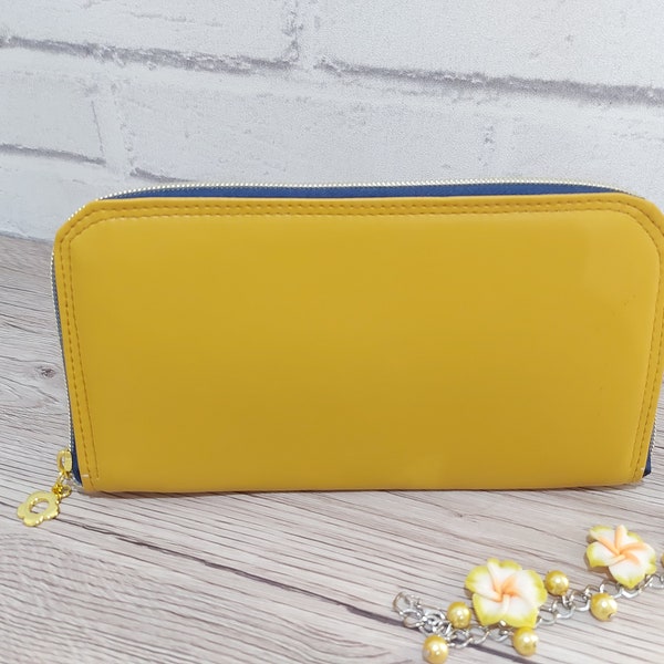 mustard yellow faux leather large zip around women's wallet purse with card and cash slots and a zippered coin pouch, carry clutch