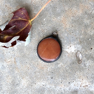 Small Round Brownish Calcite Pendant