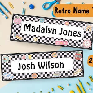 May include: Two retro name tags with a black and white chequered border. One tag reads "Madalyn Jones" and the other reads "Josh Wilson". Both tags have colourful illustrations of school supplies and flowers. The text "Retro Name Tags!" and "2 Styles!" are also visible.