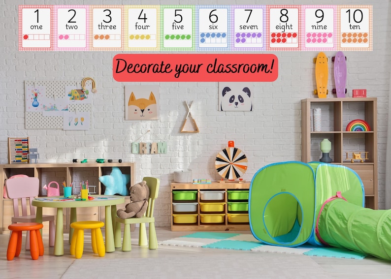May include: Colorful classroom scene with number flashcards from one to ten. The text "Decorate your classroom!" is displayed in red. The room includes a table, chairs, and a play tent.