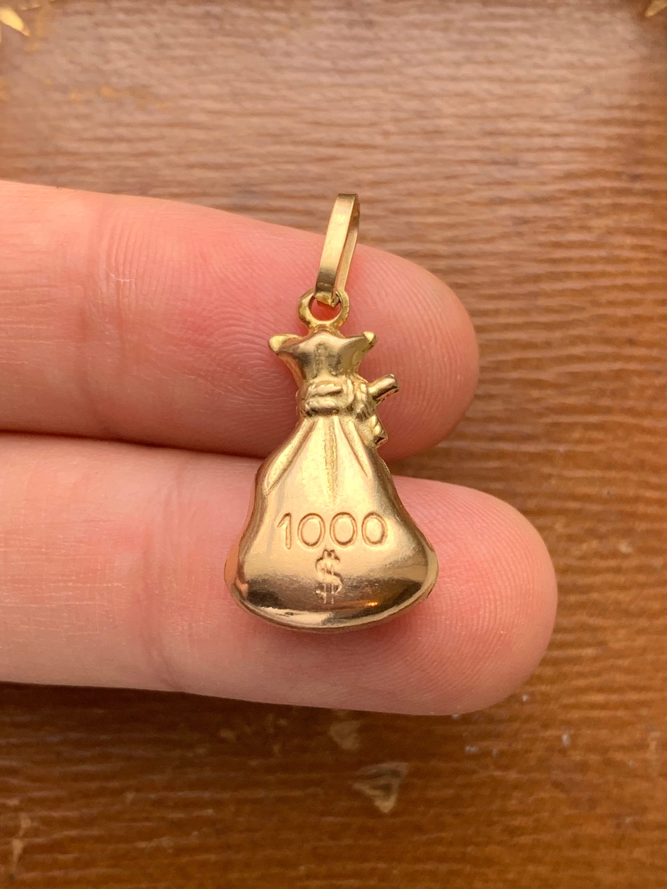 Gold money bag charm deals