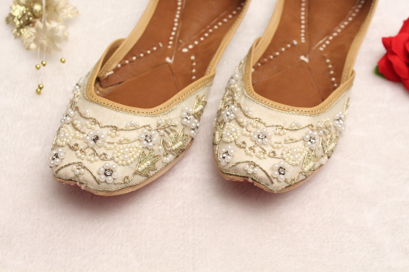 white and gold flats