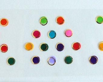 Kleurrijke ronde bindi's: Indiase voorhoofdstickers met gouden rand