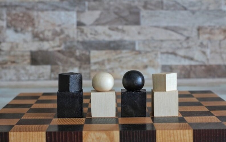 chess set handmade	large chess board	chess backgammon	chess board table	unique chessboard	modern checker board	patterned chessboard	chess set 3 in 1	exclusive chess	hand carved chess	Folding chess board	mid century ebony	decorative chess
