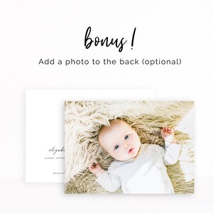 May include: A close-up photo of a baby lying on a fluffy white blanket. The baby is wearing a white onesie and has blue eyes. The photo is perfect for a baby shower or a new baby announcement.