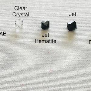 May include: Five different types of beads, including clear crystal, crystal AB, jet hematite, jet, and black diamond.