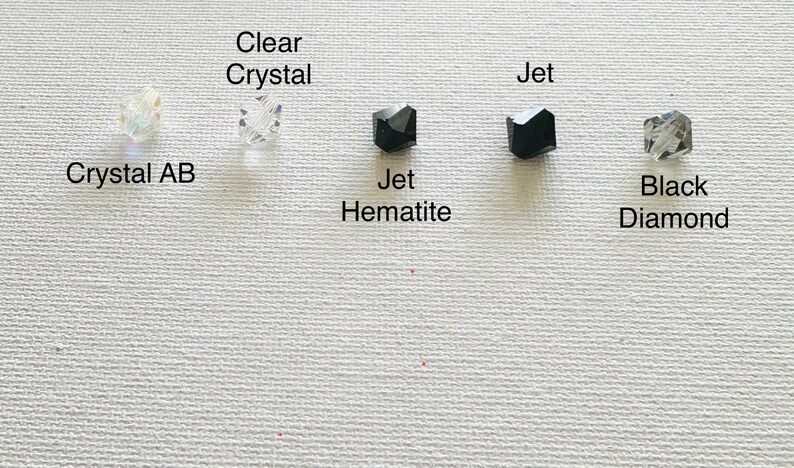 May include: Five different types of beads, including clear crystal, crystal AB, jet hematite, jet, and black diamond.