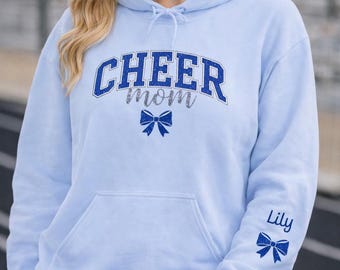 Personalized Cheer Mom Hoodie Bow Sleeve Custom Name Cheerleading Sweatshirt Gift Team Mom Trendy Mom Blue Bow Design Competition Day Wear