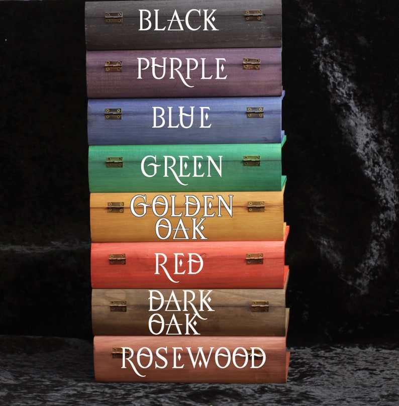 May include: A stack of eight wooden boxes with different colored finishes. The boxes are labeled with the following colors: Black, Purple, Blue, Green, Golden Oak, Red, Dark Oak, and Rosewood.