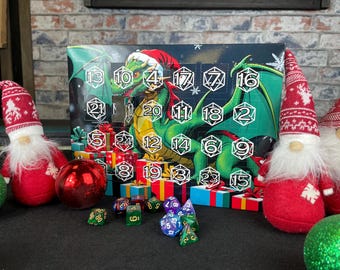 May include: A green dragon with a Santa hat is featured on a Christmas advent calendar. The calendar has 24 numbered doors, each with a different design. The calendar is surrounded by red and white gnomes and dice.