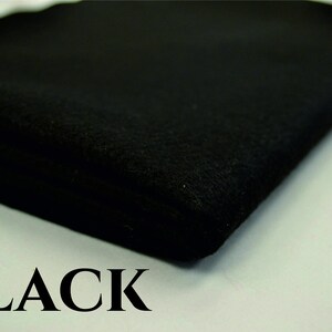 May include: A close-up of a black fabric swatch. The fabric is soft and has a smooth texture. The word "BLACK" is printed in white letters below the fabric.