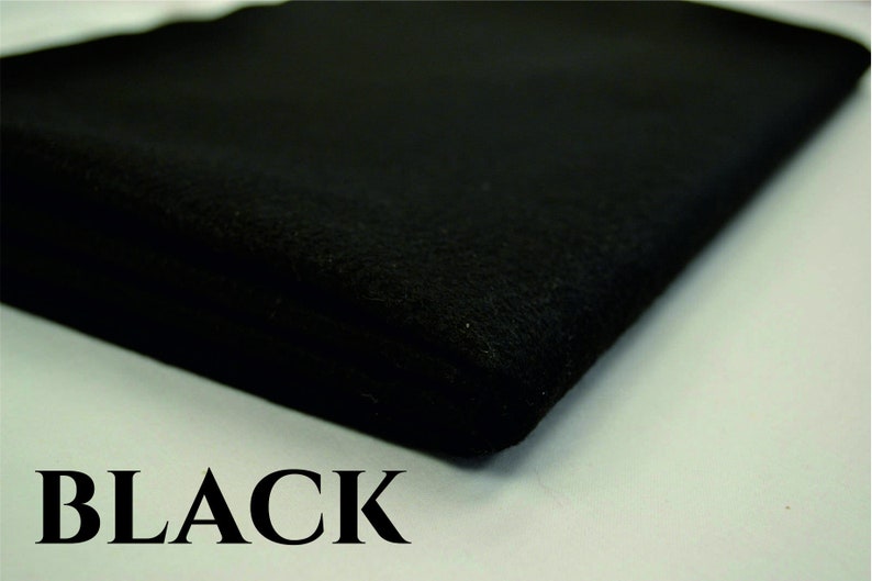 May include: A close-up of a black fabric swatch. The fabric is soft and has a smooth texture. The word "BLACK" is printed in white letters below the fabric.