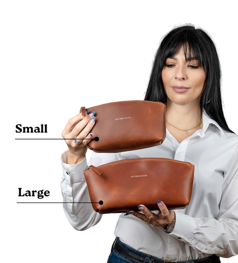 May include: Two brown leather cosmetic bags, one labeled "Small" and the other labeled "Large". Both bags have a zipper closure and a small leather loop.