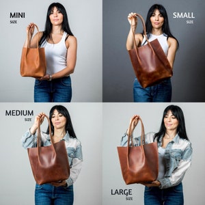 May include: Four brown leather tote bags in different sizes: mini, small, medium, and large. Each bag is held by a person in front of a white or gray background.