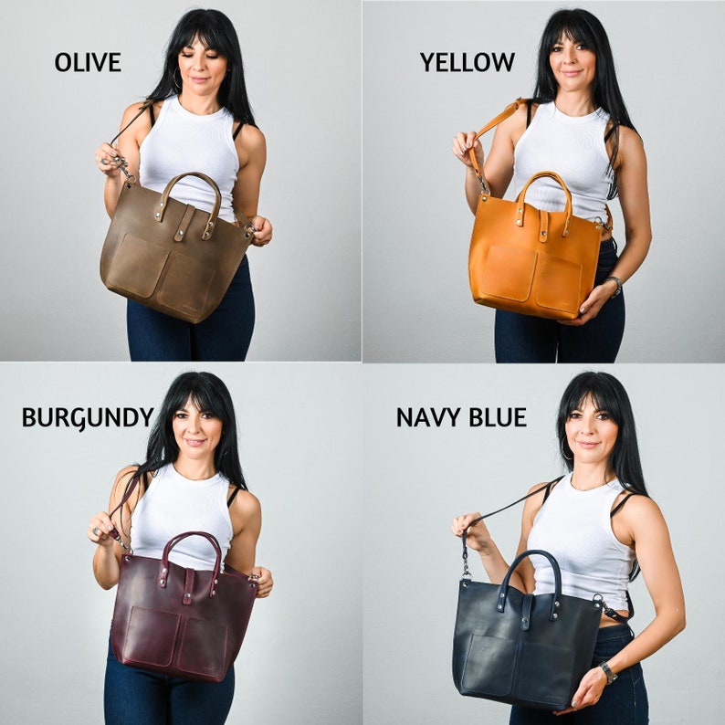May include: Four leather tote bags in different colors: olive, yellow, burgundy, and navy blue. Each bag has a top handle and a long strap. The bags are shown on a white background.