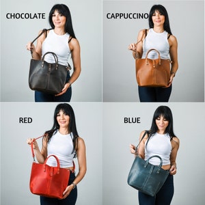 May include: Four leather tote bags in different colors: chocolate, cappuccino, red, and blue. Each bag has a top zipper closure, a front pocket, and a detachable shoulder strap.