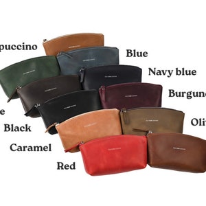 May include: A variety of leather cosmetic bags in different colors, including cappuccino, green, chocolate, black, caramel, red, blue, navy blue, burgundy, olive, and cognac.