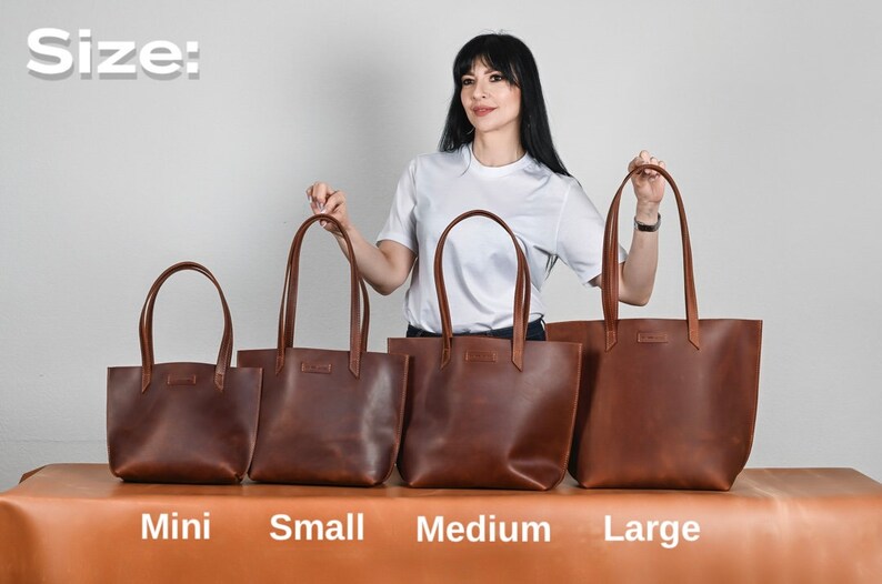 May include: Four brown leather tote bags of varying sizes are displayed. The sizes are labeled: Mini, Small, Medium, and Large. The bags have long handles and a rectangular shape. The text "Size:" is at the top of the image.