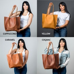 May include: Four leather tote bags in different colors: cappuccino, yellow, caramel, and cognac. Each bag has a simple design with two handles.