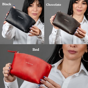 May include: Three small leather zippered pouches in black, brown, and red. Each pouch has the text "Old Pony Leather" embossed on the front.
