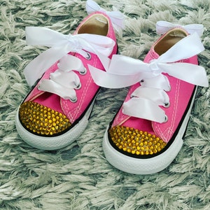 Pink converse with gold crystal