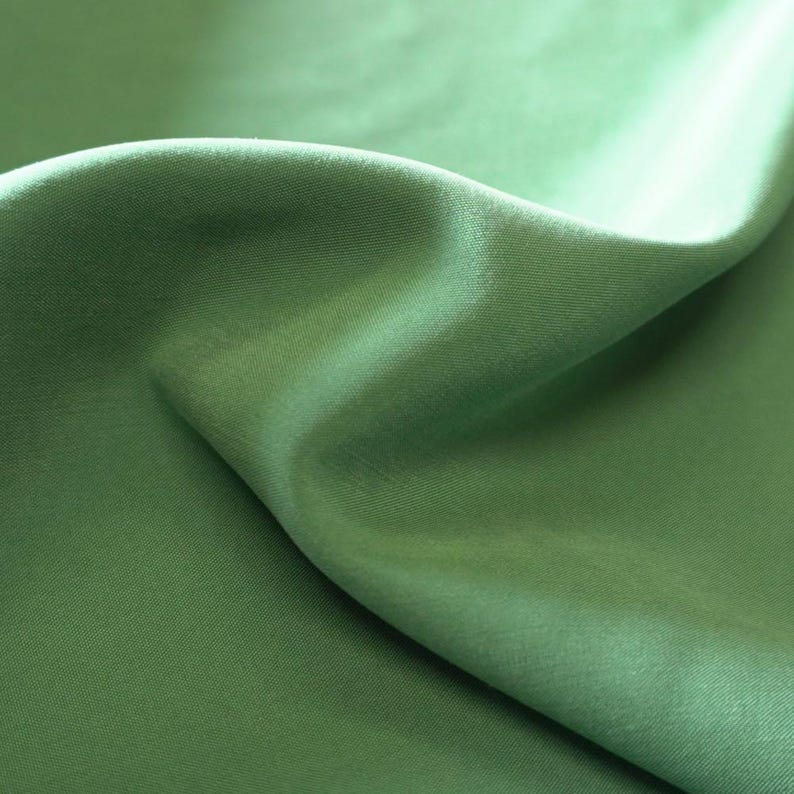 May include: A handmade wooden sign with the text "Welcome" in a playful font. The sign is painted white with a distressed finish, and features a decorative floral design in shades of pink and green. It measures approximately 12 inches wide.