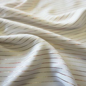 Metallic pin stripe viscose crepe fabric