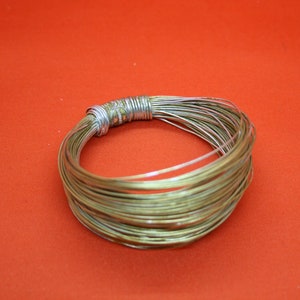Jean Paul Gaultier bracelet original vintage early 90s signed JPG, designer jewelry bangle gold plated wire Africa Paris Catwalk