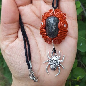 Stone pendant with Spider charm