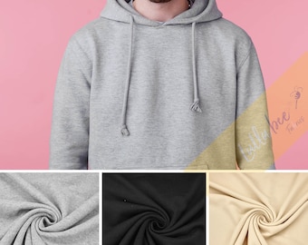 May include: A grey, black and beige hooded sweatshirt with a drawstring. The fabric is shown in a close-up image.