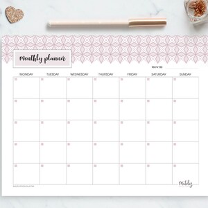 May include: A printable monthly planner with a pink and white geometric pattern border. The planner has a simple design with boxes for each day of the week, Monday through Sunday. The text "monthly planner" is at the top of the page.