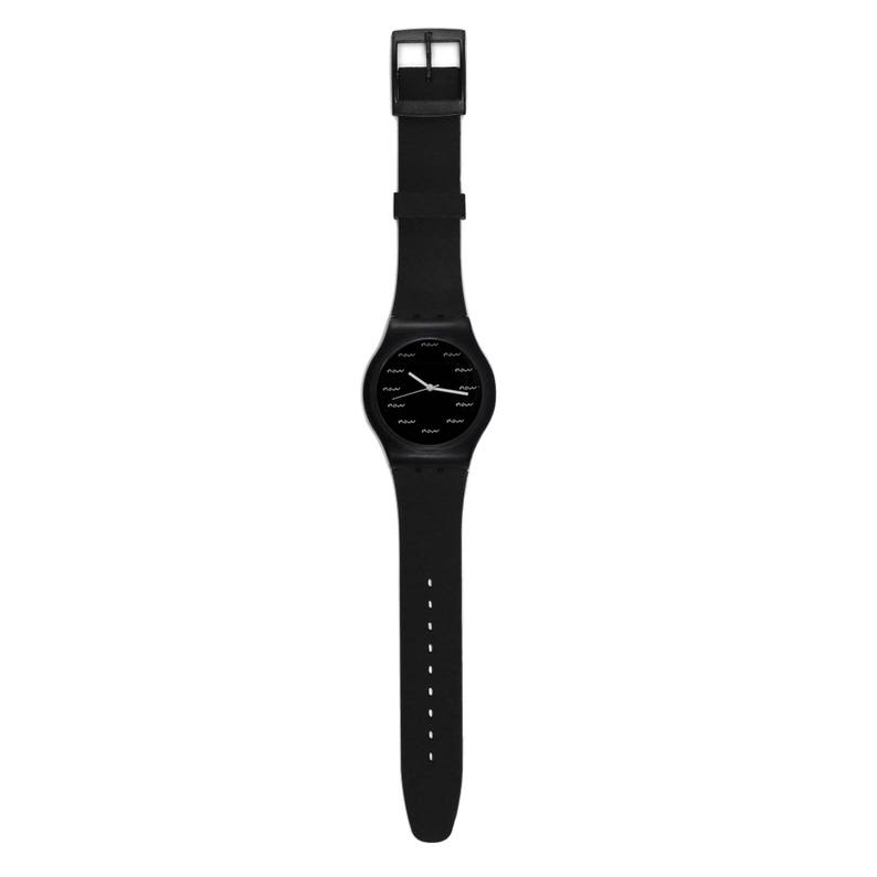 May include: A black wristwatch with a black band and a black face with white numbers and hands.