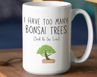 May include: White ceramic coffee mug with a black and white graphic that says "I have too many bonsai trees (Said No One Ever)" and a small green bonsai tree illustration.