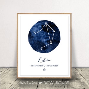 May include: A framed print showing the Libra constellation, illustrated with white lines on a dark blue, starry backdrop. The word "Libra" is written in cursive below, with the dates 23 September / 22 October and the Libra symbol.