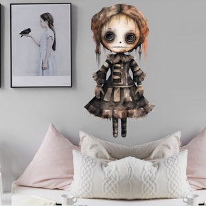 May include: A watercolor illustration of a spooky doll with a stitched mouth, large eyes, and a tattered dress. The doll is painted in shades of brown, black, and white.