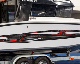 May include: A white boat with black and red racing stripes on the side. The boat is on a trailer with two wheels.