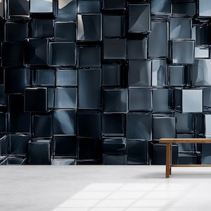May include: A dark, textured wall composed of numerous square, reflective blocks. The blocks are arranged in a three-dimensional pattern, creating a sense of depth and shadow. A wooden table with two vases sits in front of the wall.