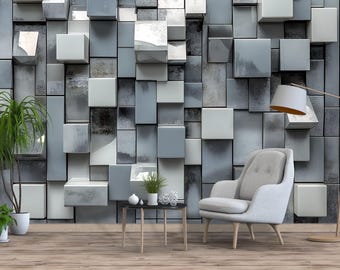 May include: A modern living room with a gray and white geometric wall design. The room features a light gray armchair, a small black side table, and a floor lamp. Potted plants add a touch of nature to the space.