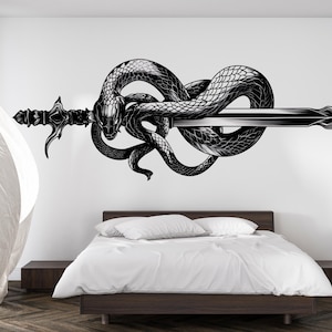 May include: Black and white wall decal of a snake coiled around a sword. The snake is detailed with scales, and the sword has an ornate handle. The image is set against a white wall above a bed with white bedding.