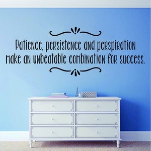 May include: A white dresser with six drawers is positioned below a light blue wall. The wall features a black decorative text that reads: "Patience, persistence and perspiration make an unbeatable combination for success."