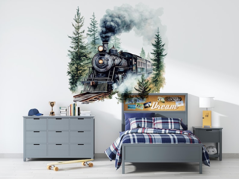 May include: A gray bedroom with a bed, a dresser, and a train engine wall decal. The bed has a gray headboard with a corkboard and the text "Dream" on it. The bed is covered with a blue and white plaid comforter. The dresser is gray with 12 drawers. The train engine decal is black and has a white smoke plume. The decal is surrounded by green trees.