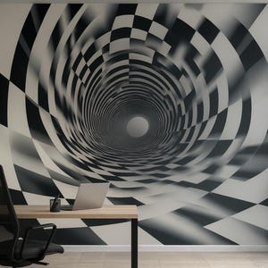 May include: A black and white checkered pattern wall mural creates a tunnel effect. A desk with a laptop and office chair are in front of the mural. A potted plant is to the right of the desk.