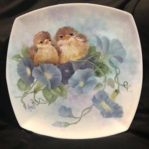 Baby Birds Sitting in Morning Glories