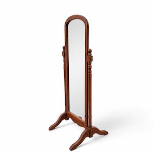 May include: A full-length floor mirror with a warm brown wooden frame. The mirror features an arched top and is supported by two vertical posts with decorative finials. It stands on a base with four curved legs, allowing the mirror to tilt.
